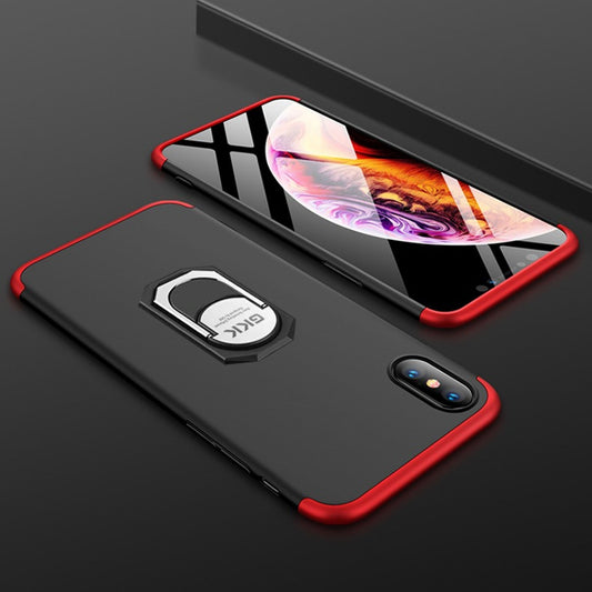 Black phone case with red accents and a ring holder on a dark surface